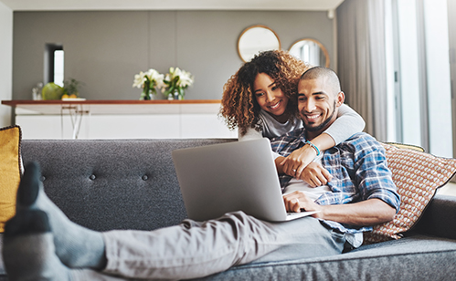 couple on computer applying for a loan at home