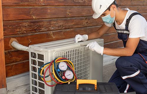 man installing HVAC system