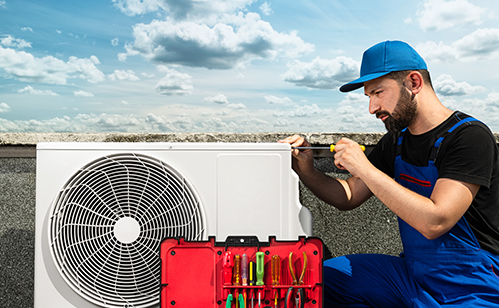 HVAC installer working on pump